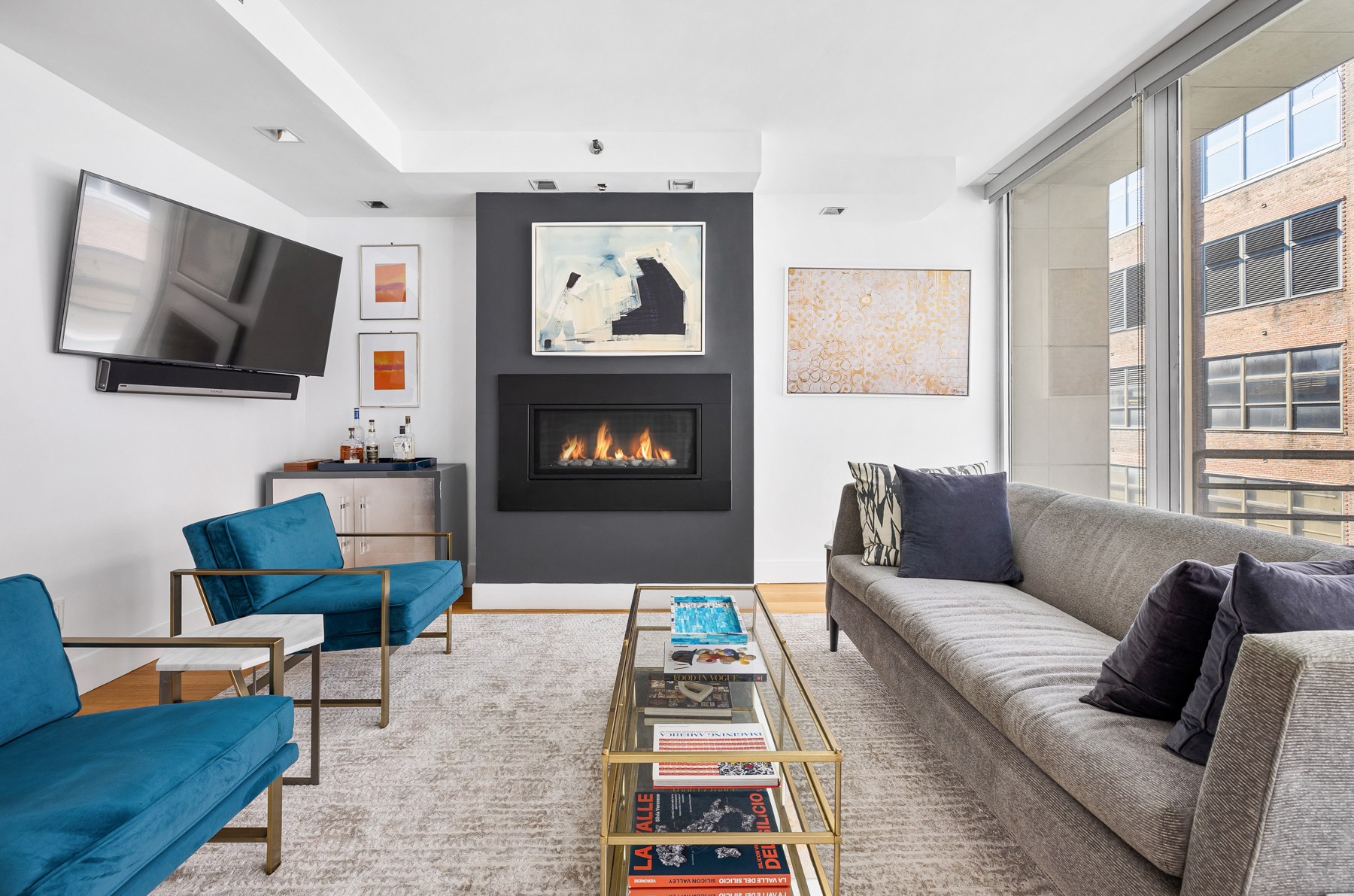 a living room with furniture and a flat screen tv
