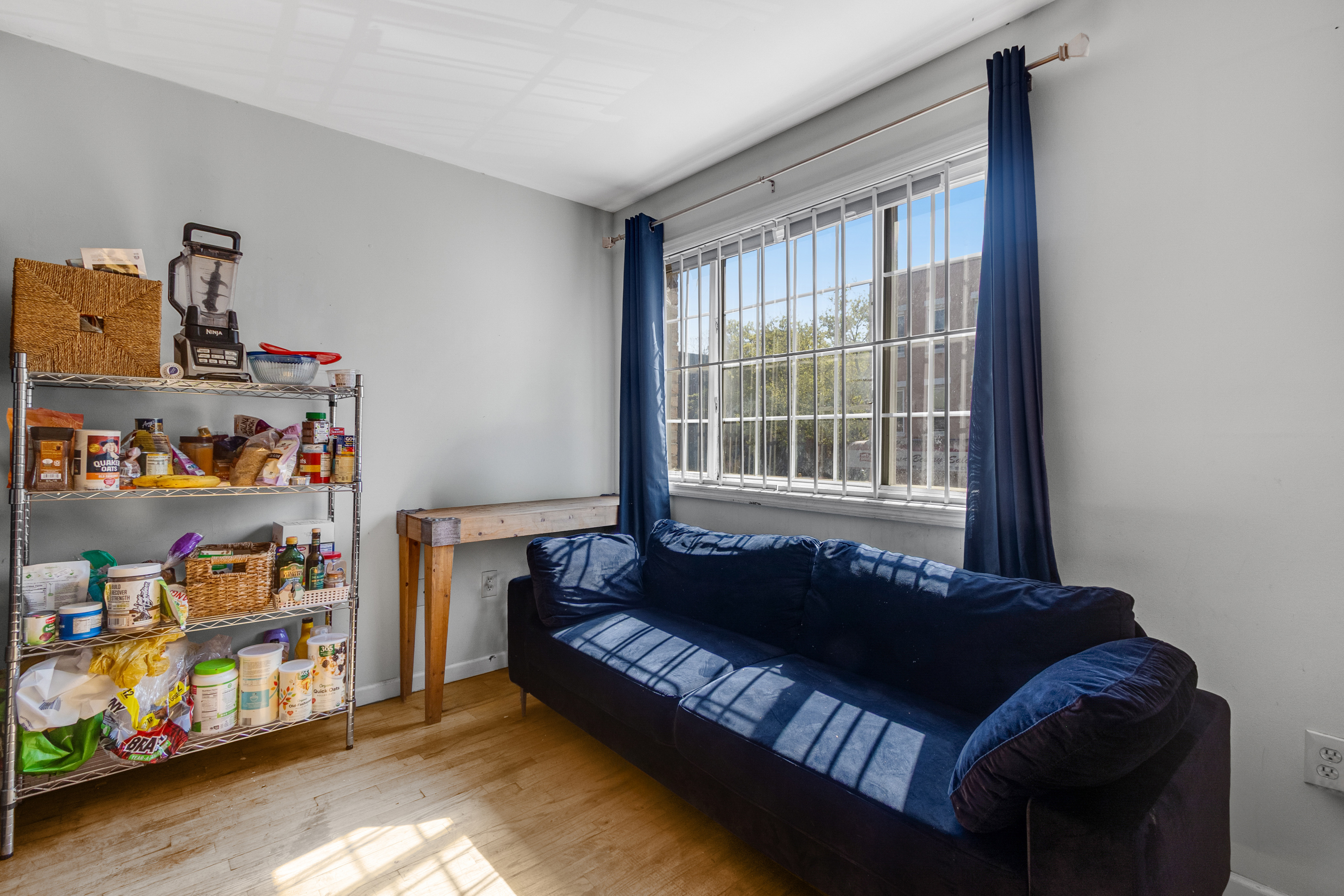 103 A Patchen Avenue Brooklyn, NY 11221 - Photo 10 of 19 a bedroom with furniture and a window