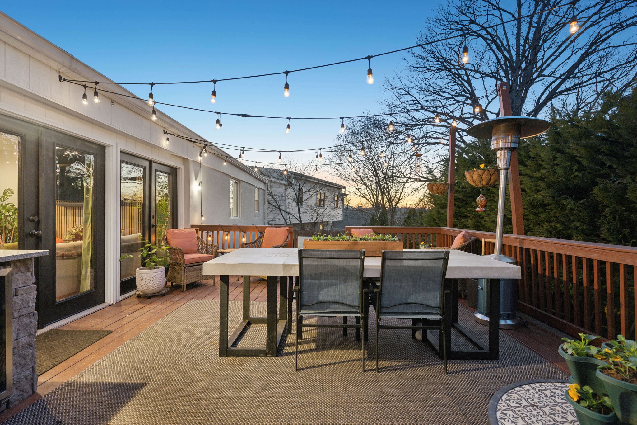 2607 Ross Road Chevy Chase, MD 20815 - Photo 35 of 37 a view of a patio with table and chairs potted plants and floor to ceiling window