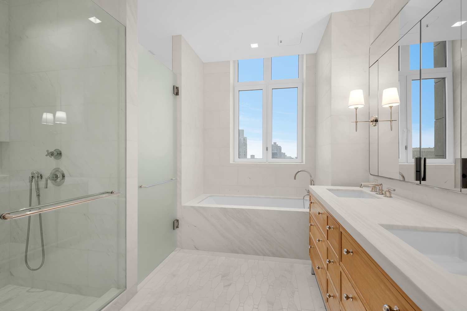 200 East 83rd Street, Unit 34A Manhattan, NY 10028 - Photo 14 of 34 a bathroom with a tub sink and mirror