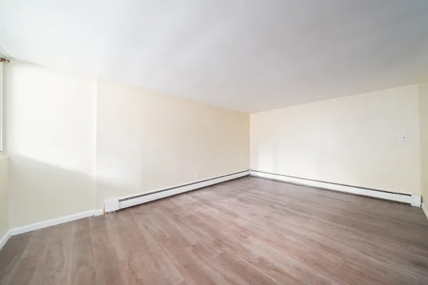 an empty room with wooden floor