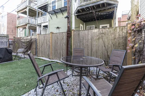 a view of a chairs and table in the patio