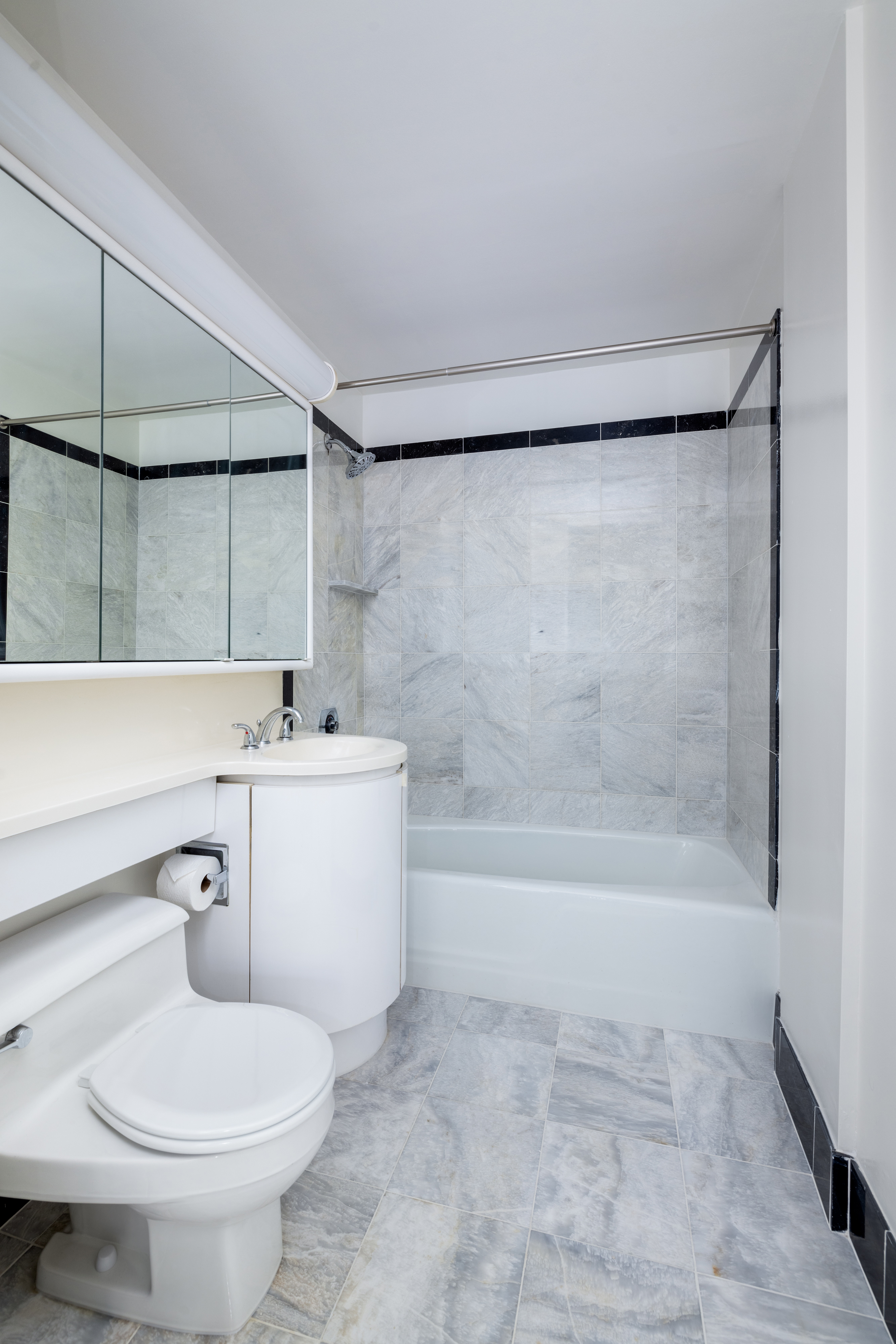 200 East 32nd Street, Unit 35C Manhattan, NY 10016 - Photo 9 of 26 a bathroom with a sink a toilet and bathtub