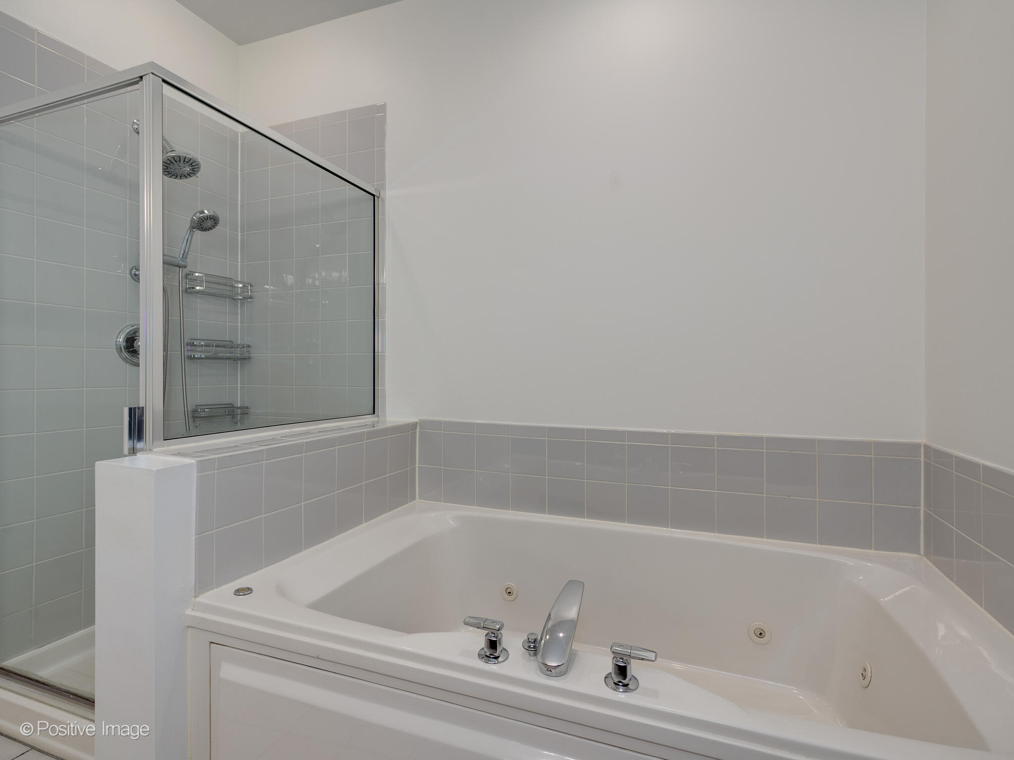 855 North May Street, Unit G Chicago, IL 60642 - Photo 22 of 28 a bathroom with a bathtub and a shower