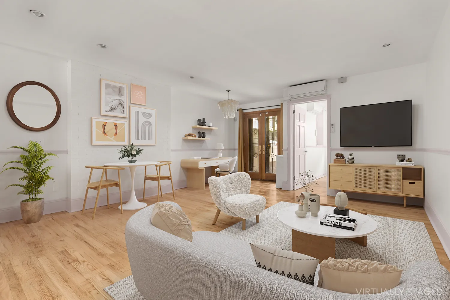 a living room with furniture and a flat screen tv