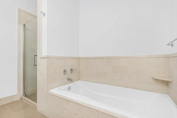 252 7th Avenue, Unit 10I Manhattan, NY 10001 - Photo 8 of 25 a bathroom with a bathtub