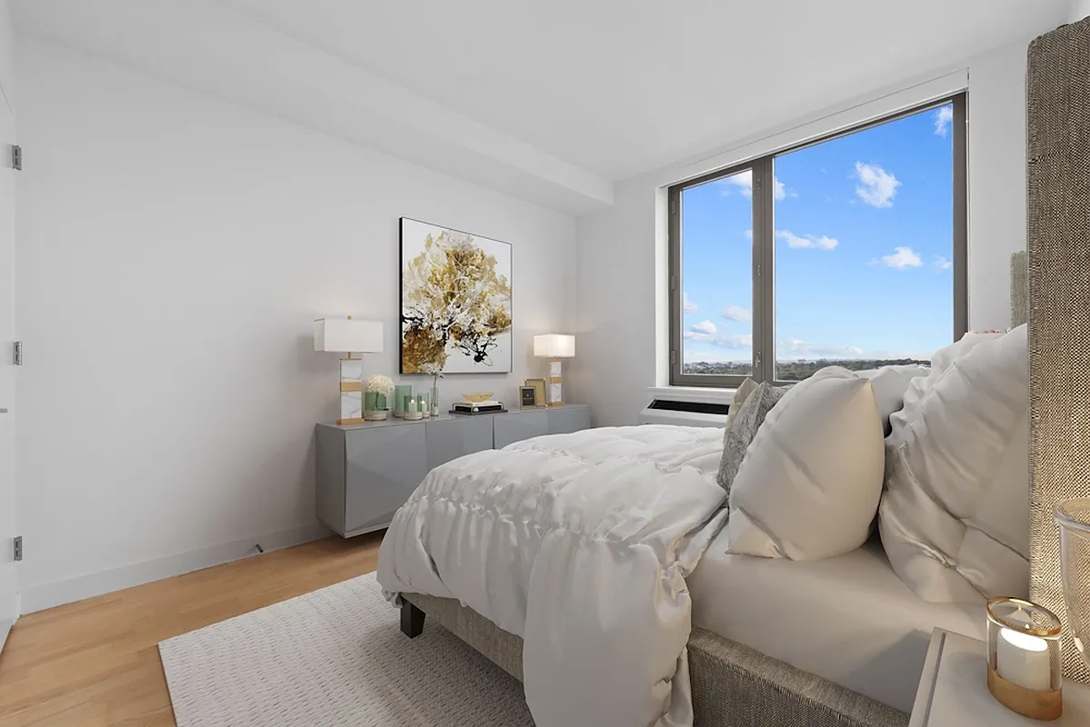 626 Flatbush Avenue, Unit 20J Brooklyn, NY 11225 - Photo 3 of 13 a bed room with a bed and a couch