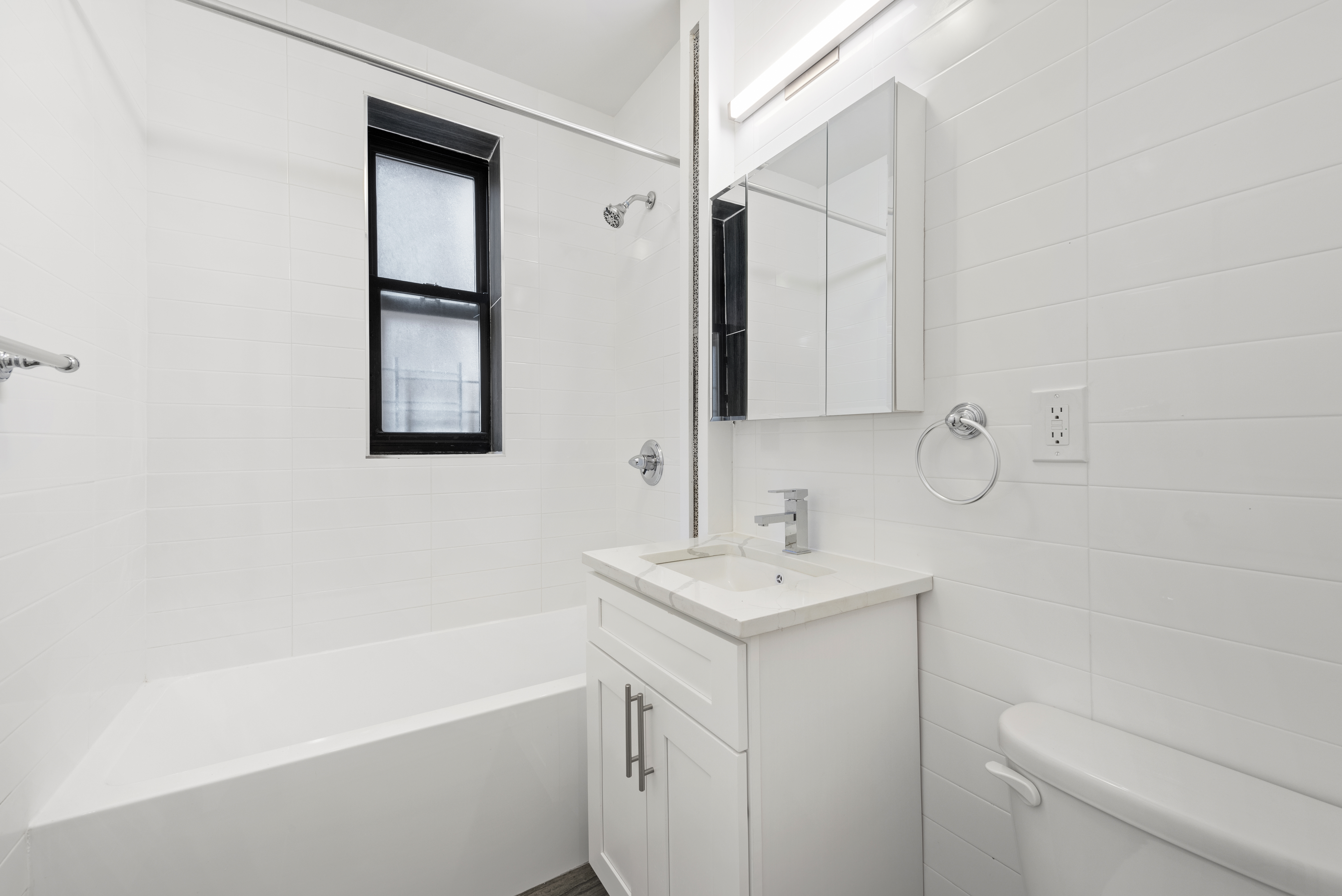 750 Riverside Drive, Unit 3B Manhattan, NY 10031 - Photo 5 of 6 a bathroom with a sink a toilet and shower