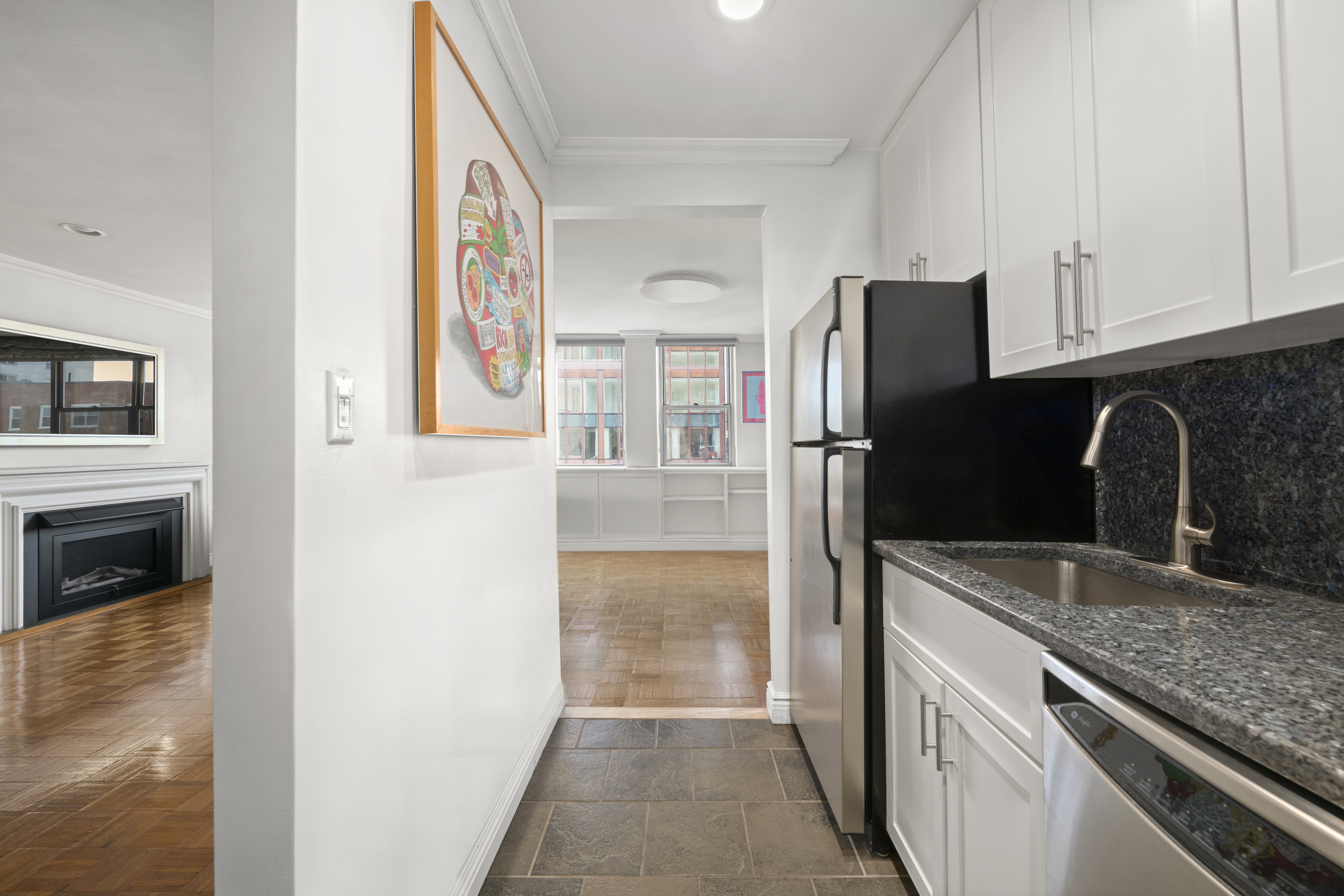 32 Gramercy Park South, Unit 15G Manhattan, NY 10003 - Photo 4 of 11 a kitchen with stainless steel appliances granite countertop a refrigerator and a stove