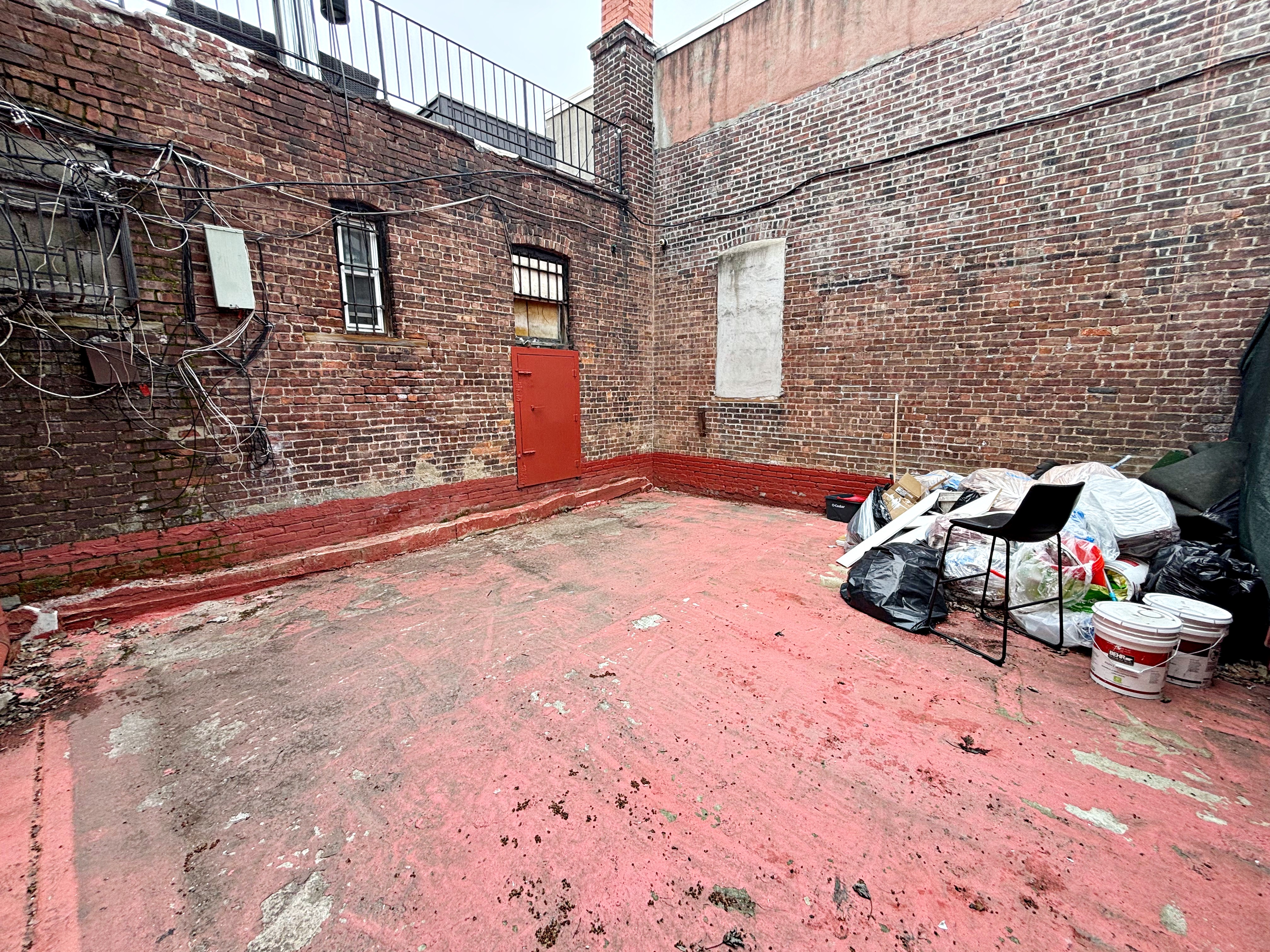 385 Nostrand Avenue, Unit Undisclosed Brooklyn, NY 11216 - Photo 10 of 27 a backyard of a house with seating space