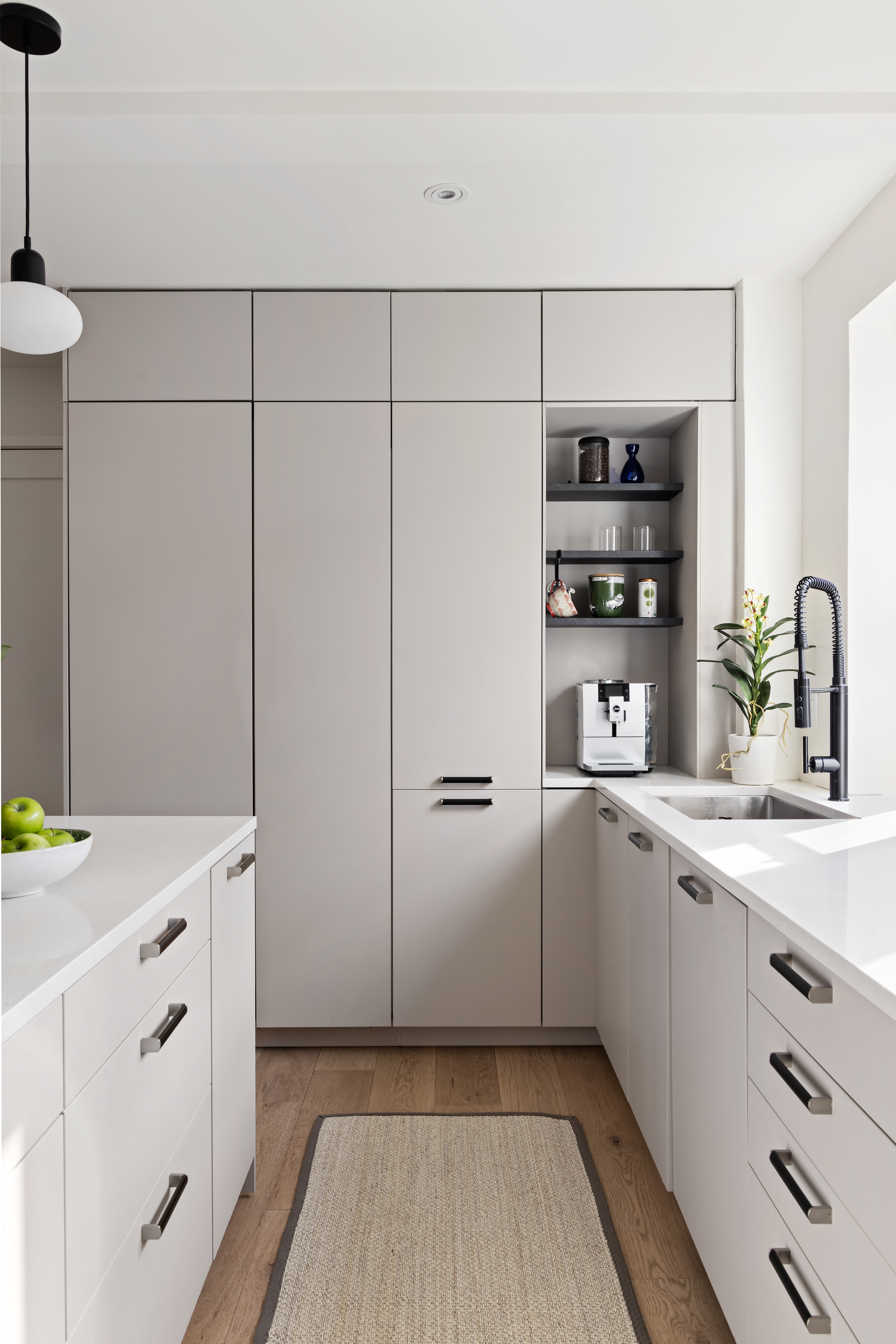 45 5th Avenue, Unit 15CD Manhattan, NY 10003 - Photo 5 of 14 a kitchen with white cabinets and white appliances