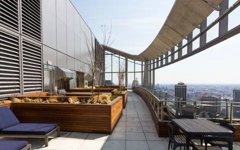 a view of balcony and yard