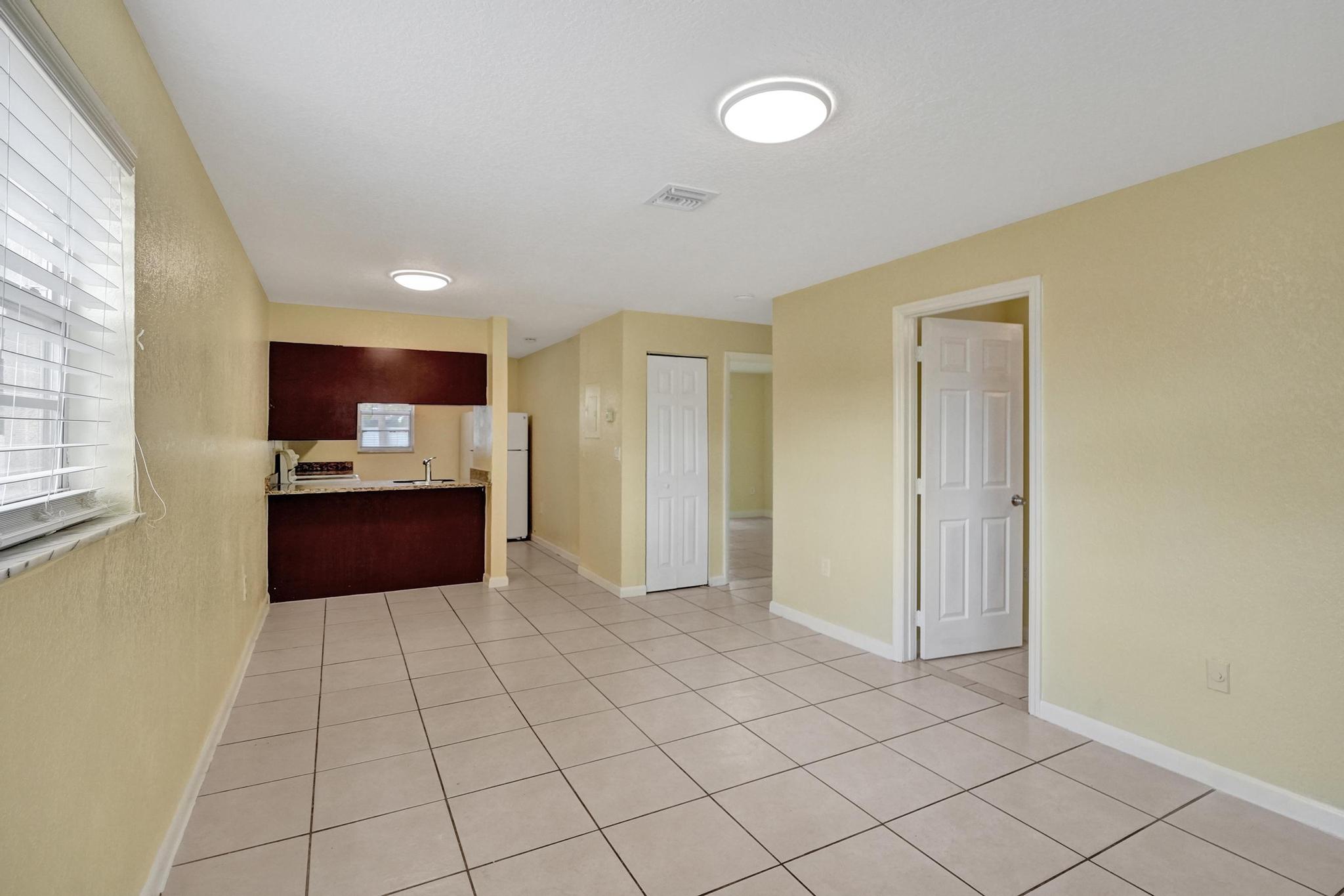 1101 Prospect Road Fort Lauderdale, FL 33309 - Photo 7 of 34 a large bathroom with a sink vanity granite and a mirror