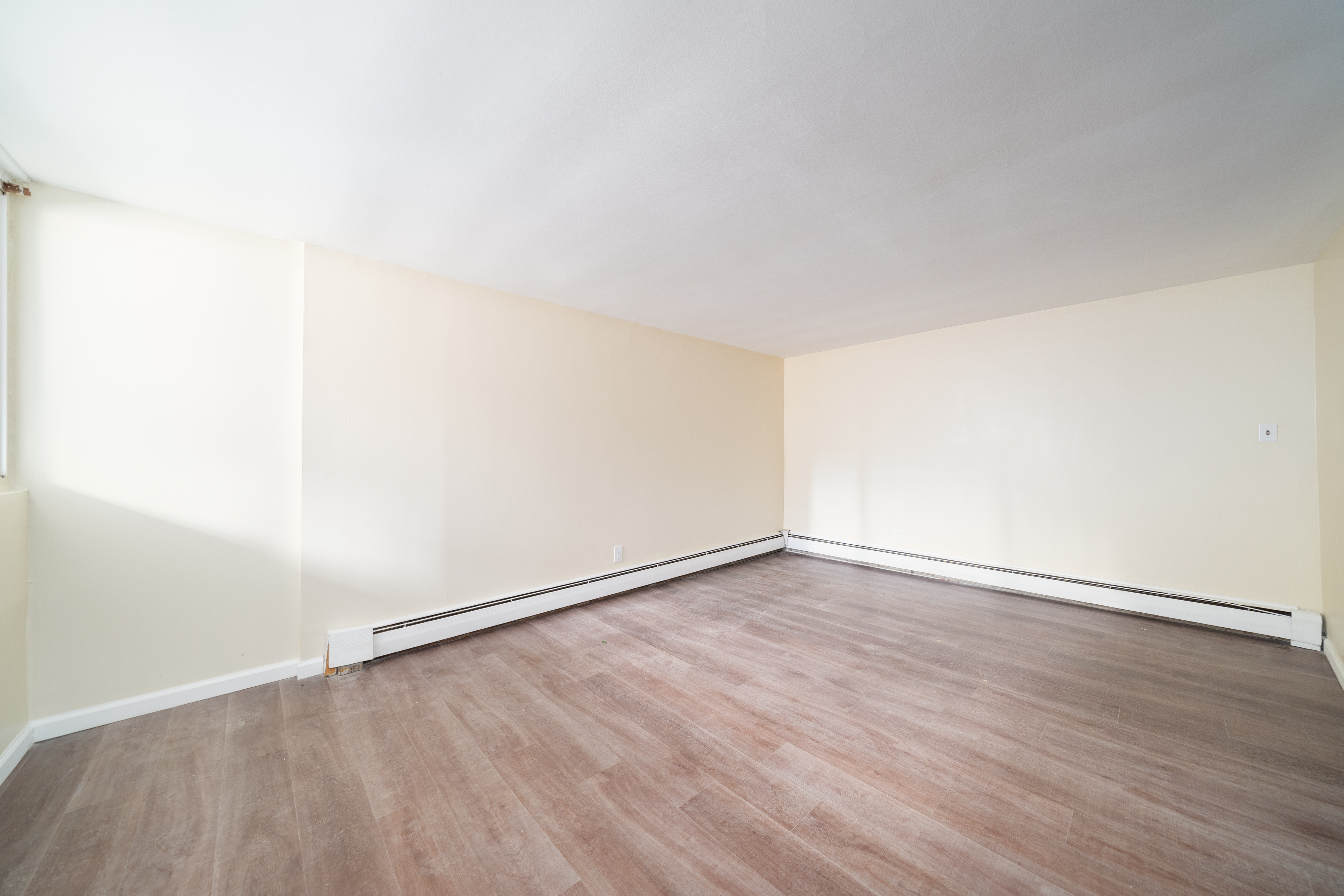 100-108 35th Street Union City, NJ 07087 - Photo 3 of 17 an empty room with wooden floor