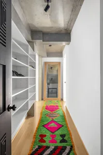 a room that has a bed and a walk in closet
