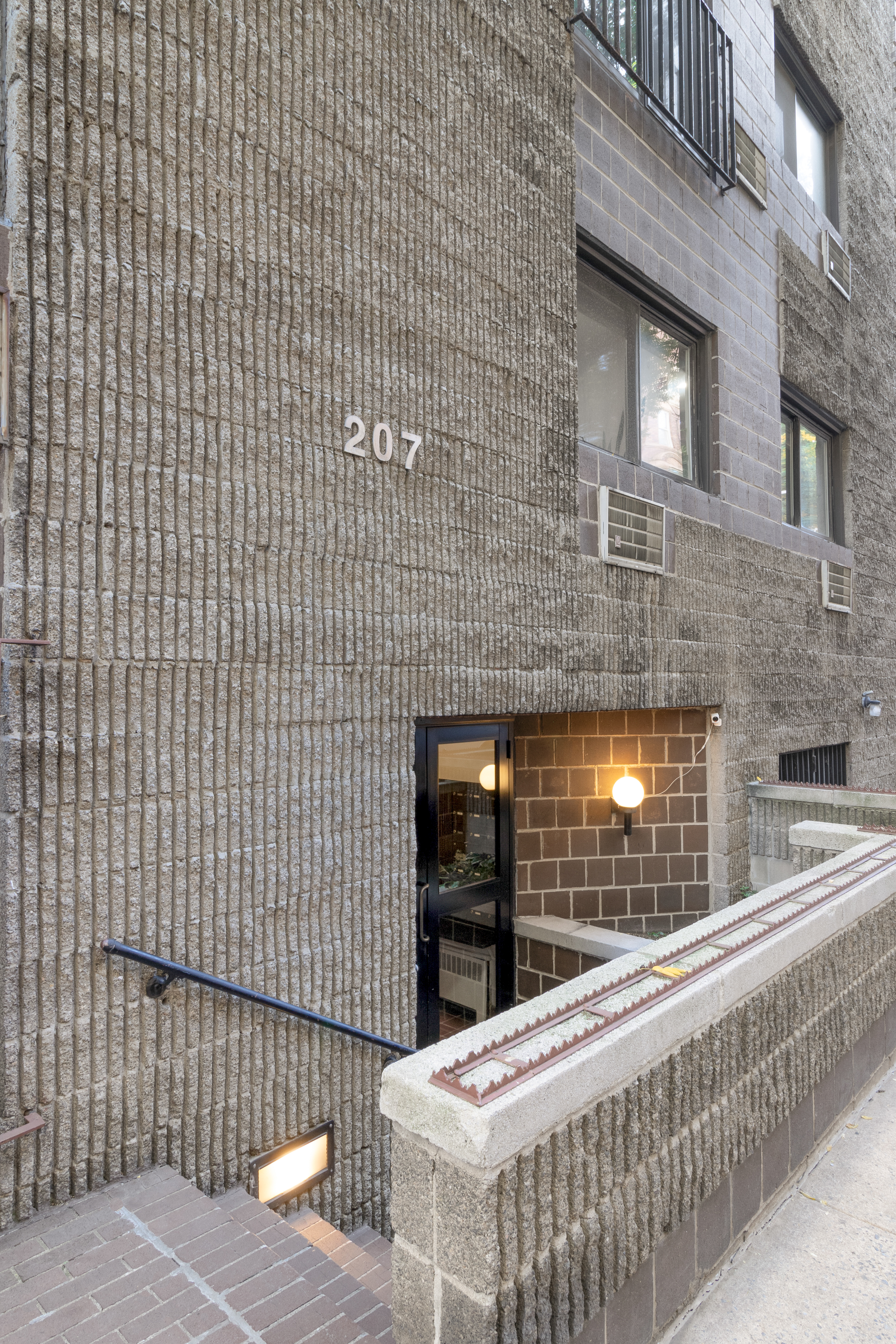 207 East 21st Street, Unit 6B Manhattan, NY 10010 - Photo 9 of 11 a brick building with a sink and a potted plant