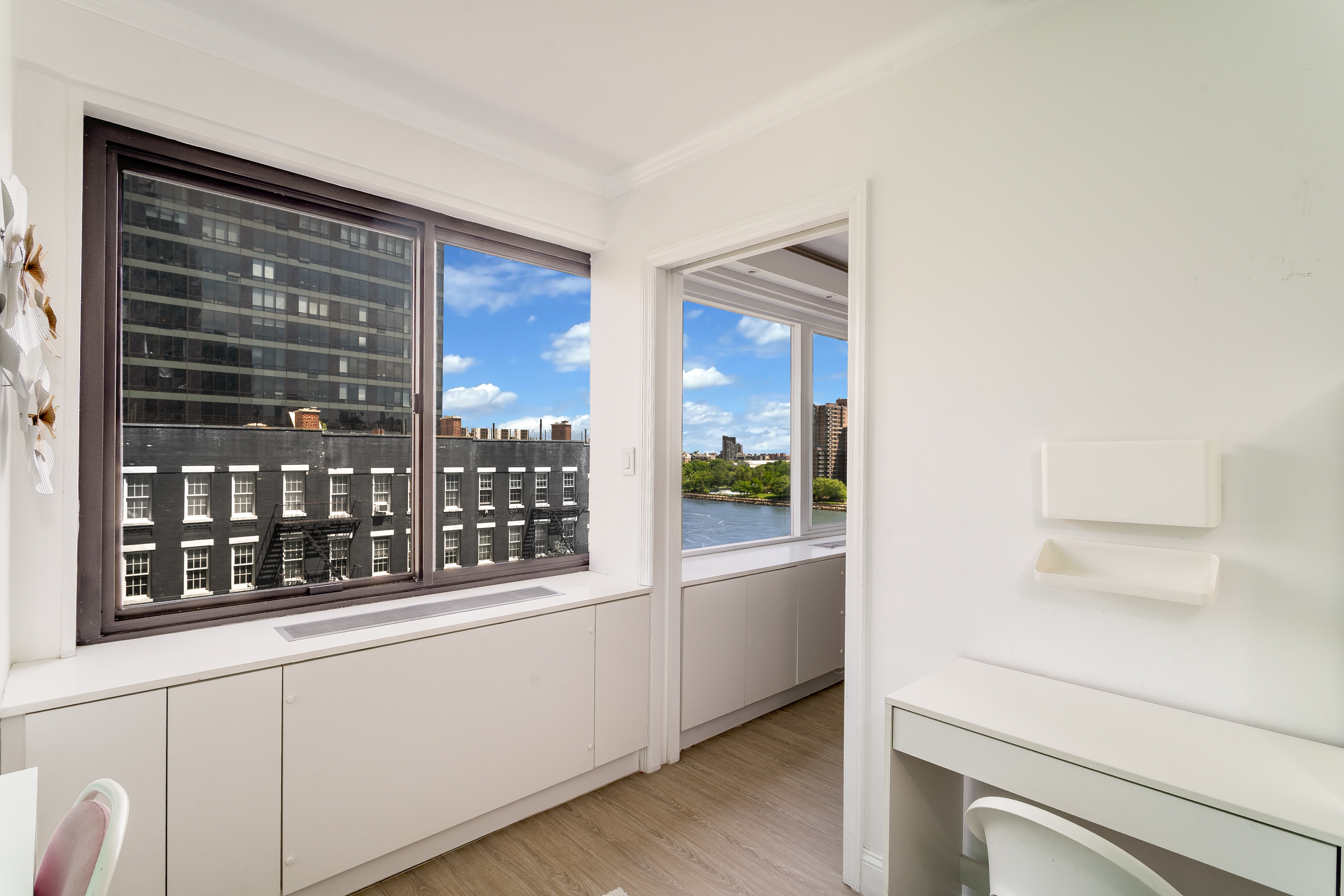 530 East 72nd Street, Unit 7C Manhattan, NY 10021 - Photo 9 of 17 a view of an entryway with kitchen