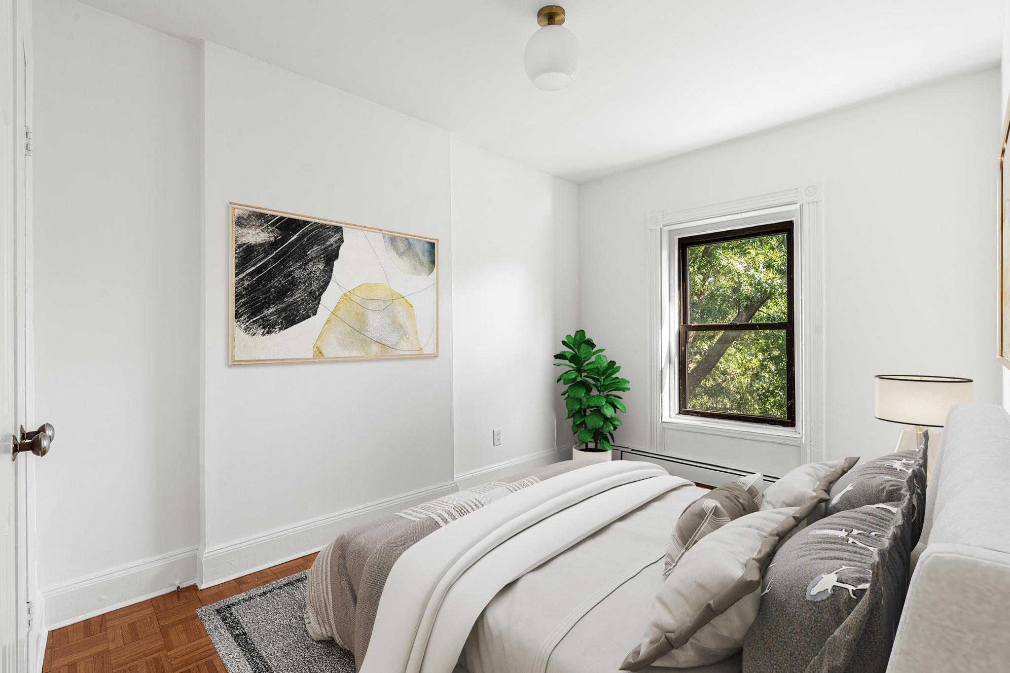 306 Lafayette Avenue, Unit 4 Brooklyn, NY 11238 - Photo 5 of 11 a bedroom with a bed and a window