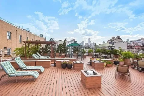 a view of roof deck with patio