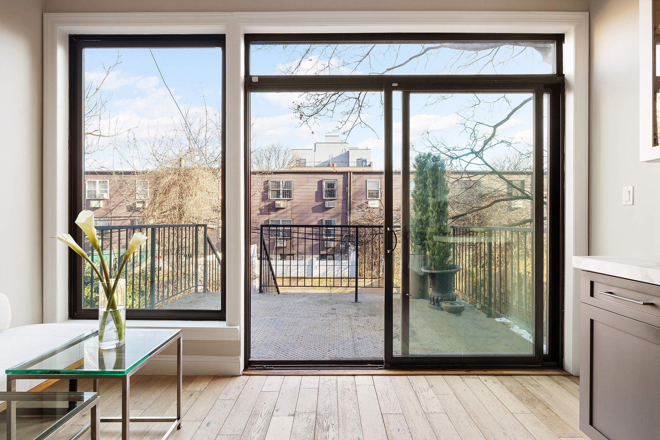 34 Woodbine Street Brooklyn, NY 11221 - Photo 9 of 15 a view of a room with wooden floor and door