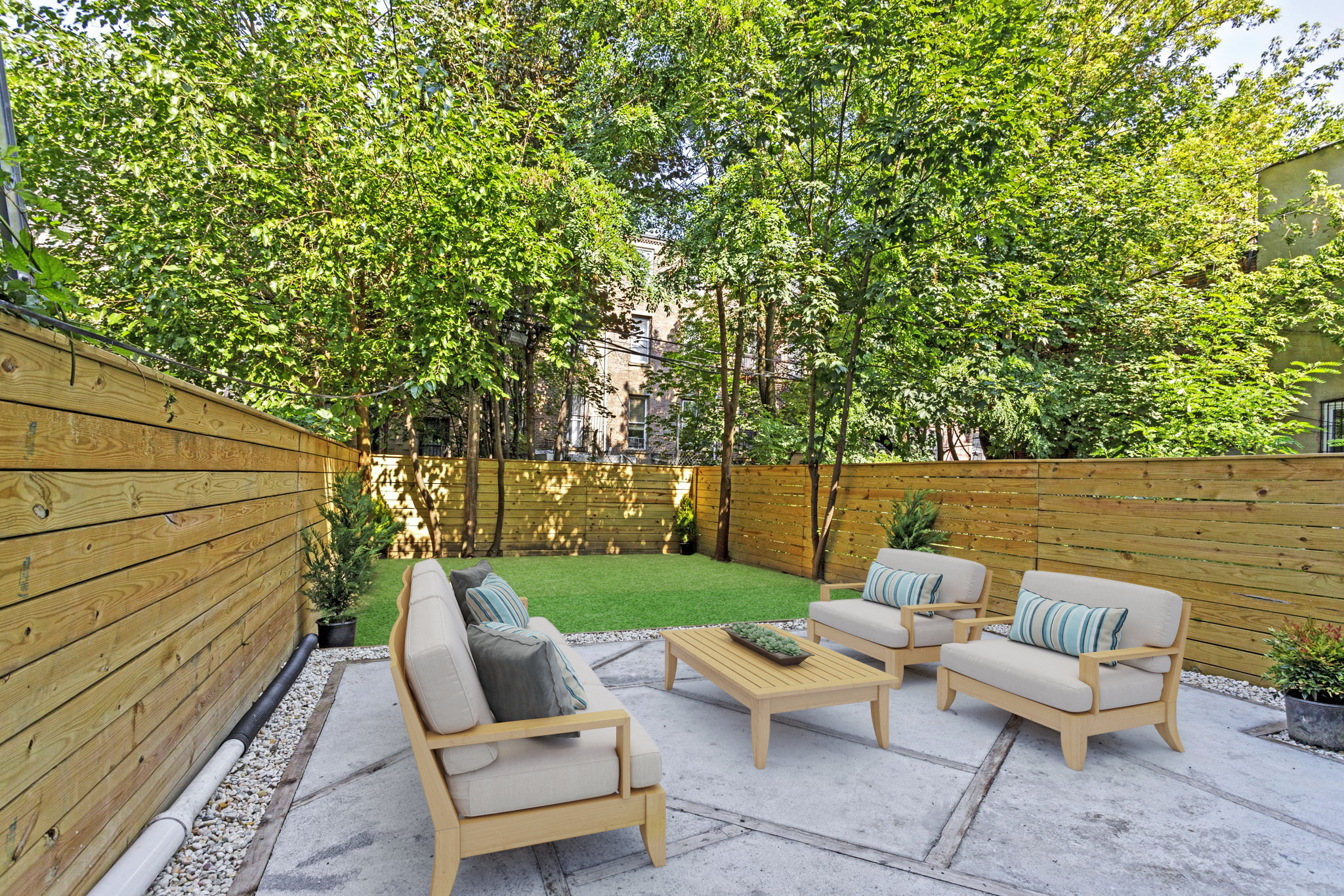 a view of backyard with seating area and green space
