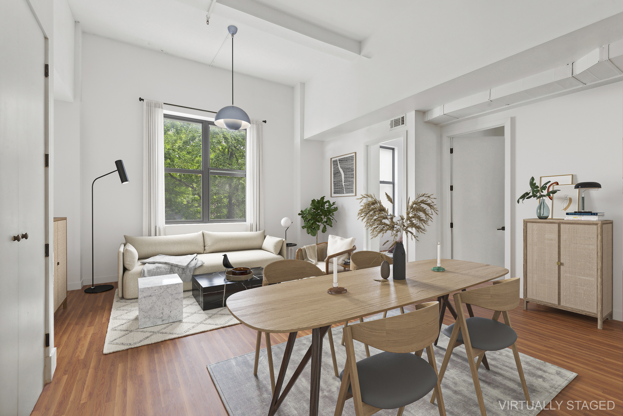 a view of a dining room with furniture window and wooden floor