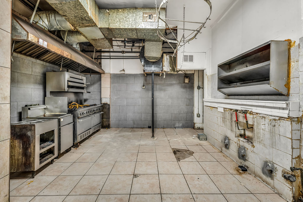 601-603 Washington Street, Unit RESTAURANT Hoboken, NJ 07030 - Photo 20 of 27 a kitchen with granite countertop a stove and a microwave