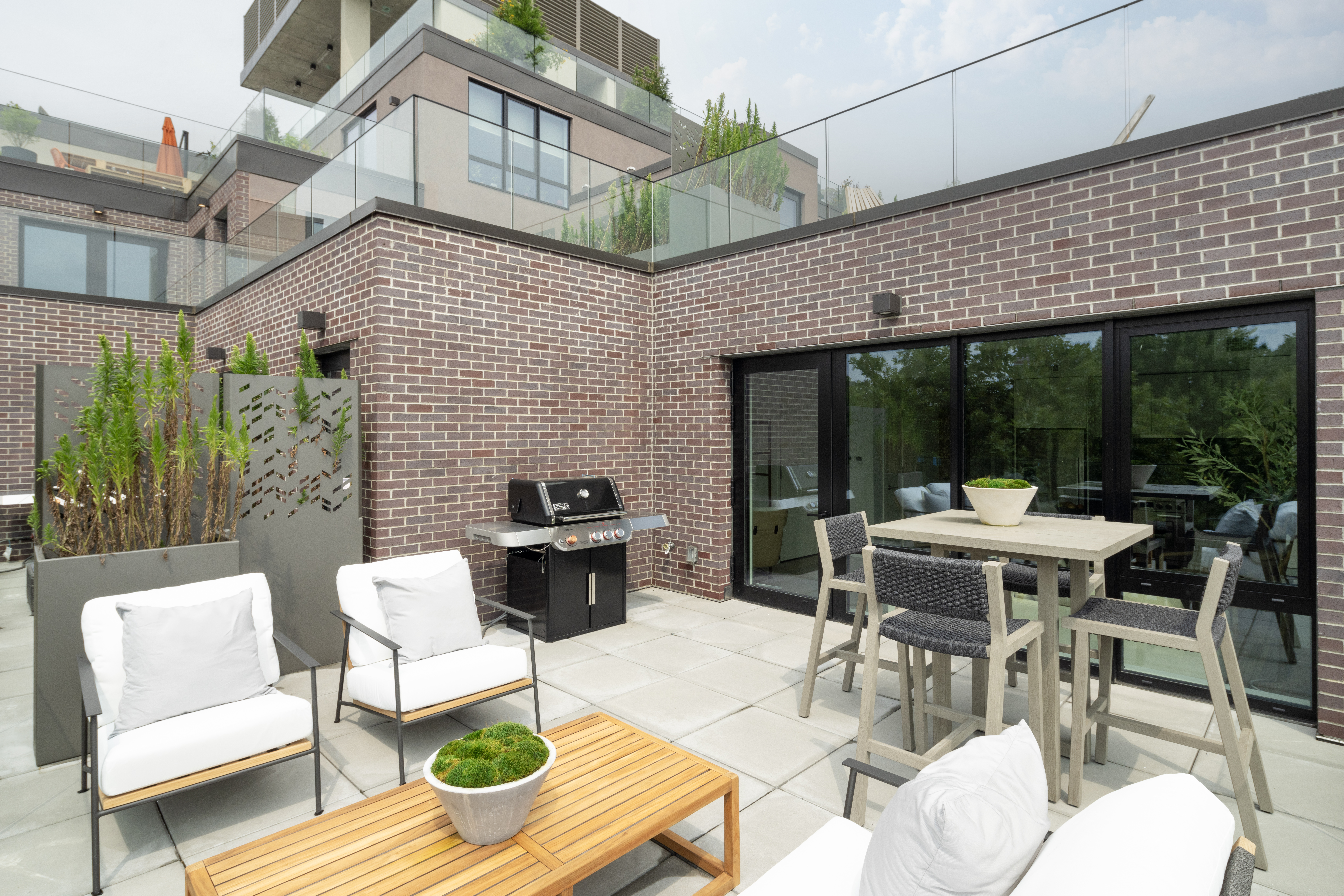 435 Tompkins Avenue, Unit PH505 Brooklyn, NY 11216 - Photo 7 of 14 a view of a patio with couple of chairs and a table