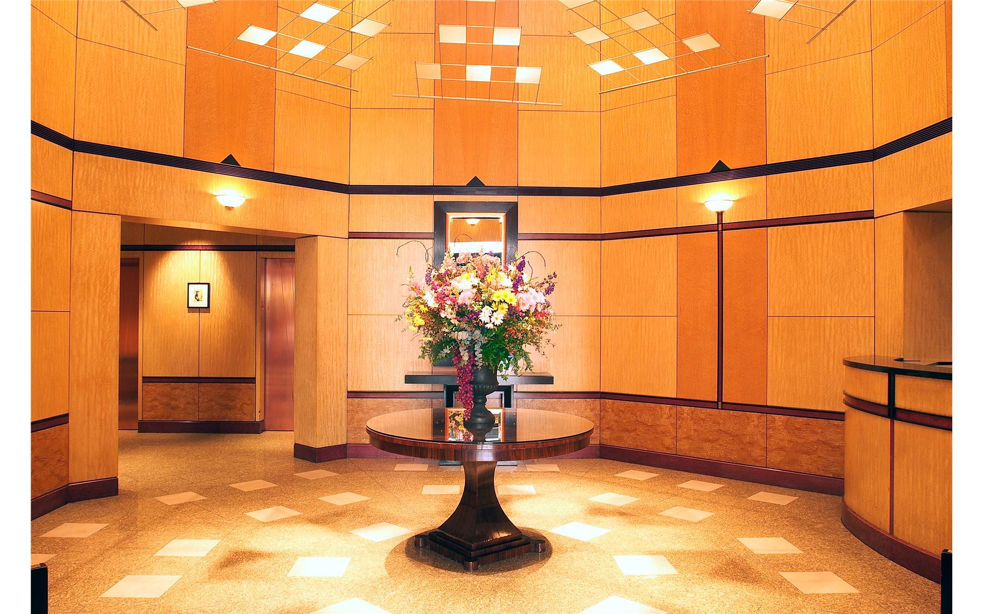 250 East 54th Street, Unit 22B Manhattan, NY 10022 - Photo 6 of 11 a vase of flowers sitting on a table
