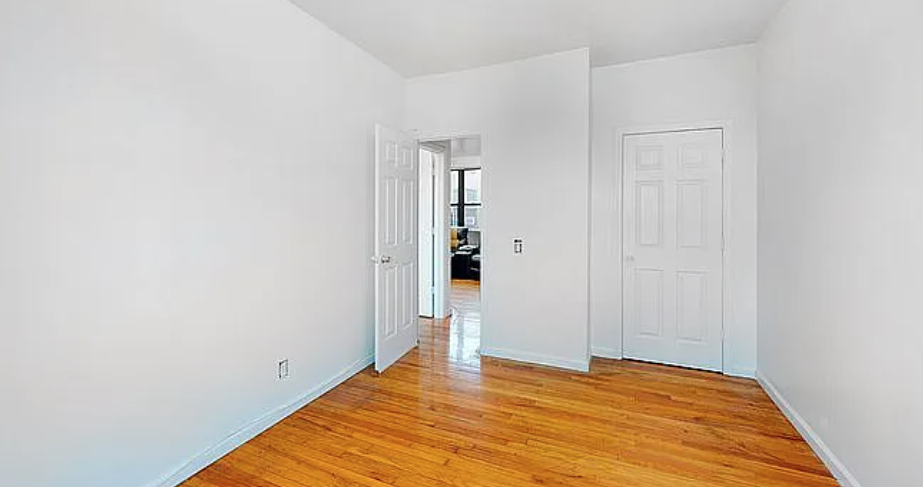 470 West 166th Street, Unit 21 Manhattan, NY 10032 - Photo 4 of 8 a view of empty room with wooden floor
