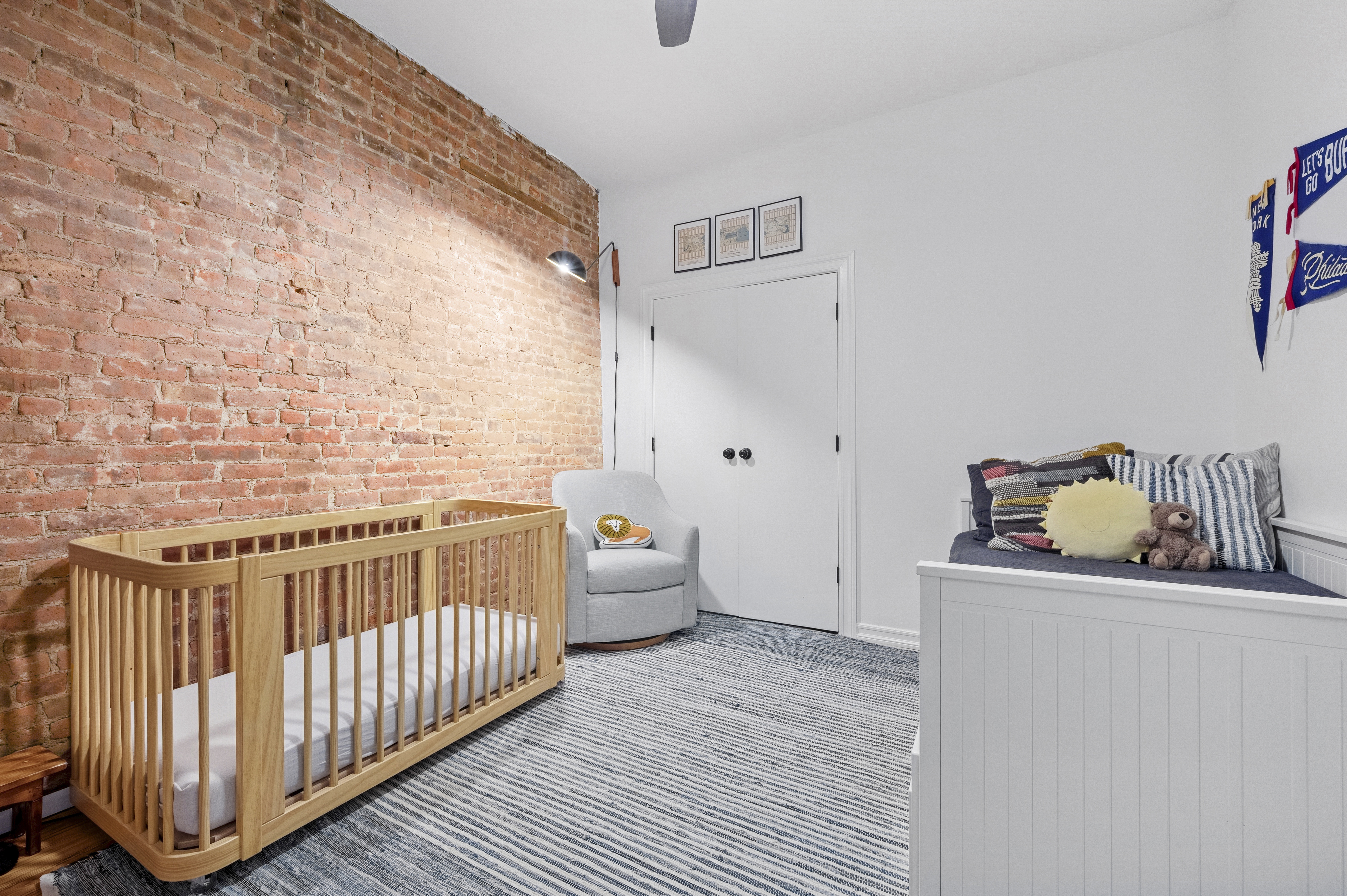 331 East 92nd Street, Unit 4B Manhattan, NY 10128 - Photo 6 of 7 a bedroom with a bed and wooden floor