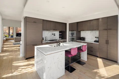 a kitchen with a sink stove and refrigerator