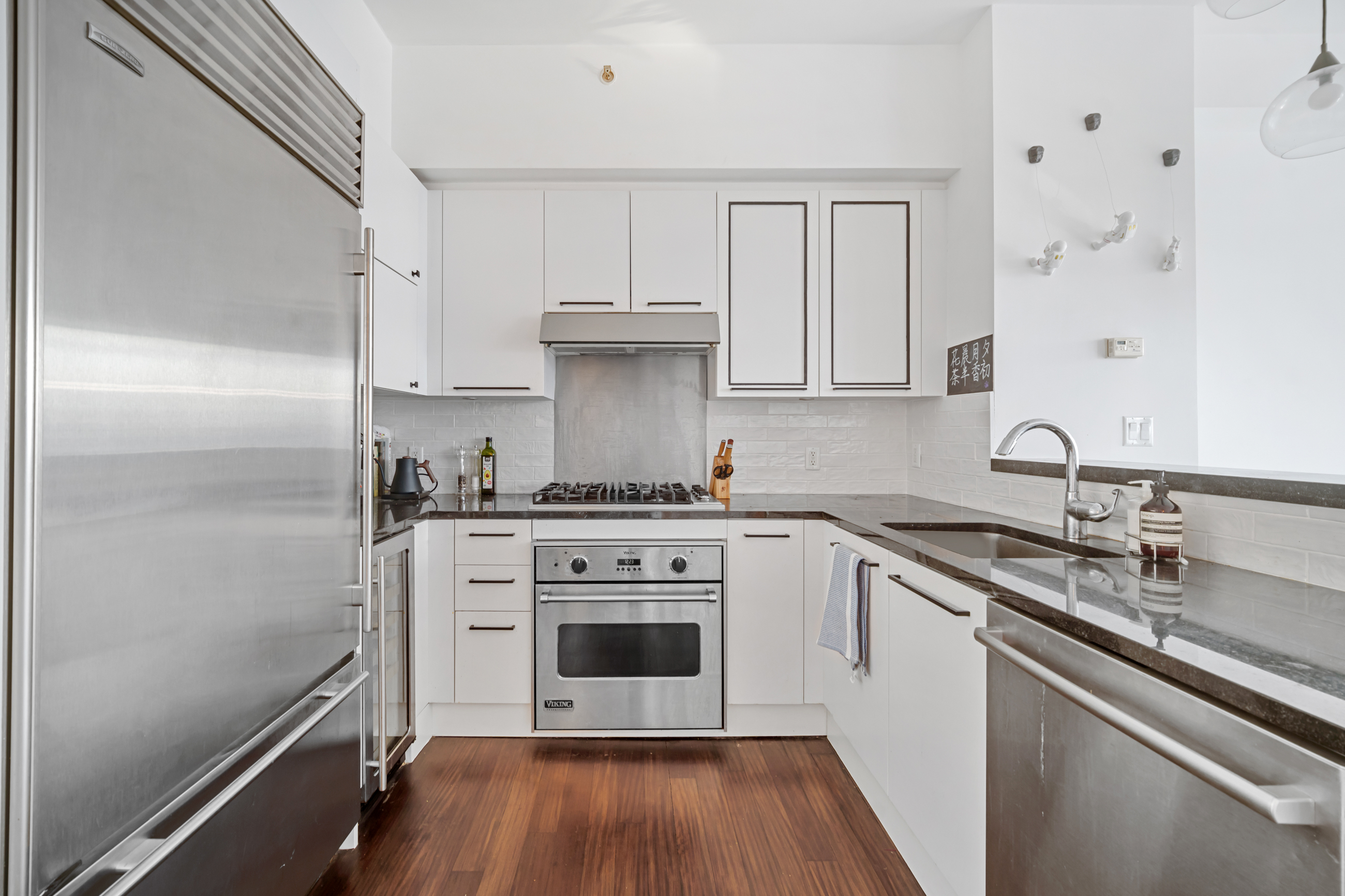 10 West End Avenue, Unit 11G Manhattan, NY 10023 - Photo 2 of 9 a kitchen with a stove oven and sink