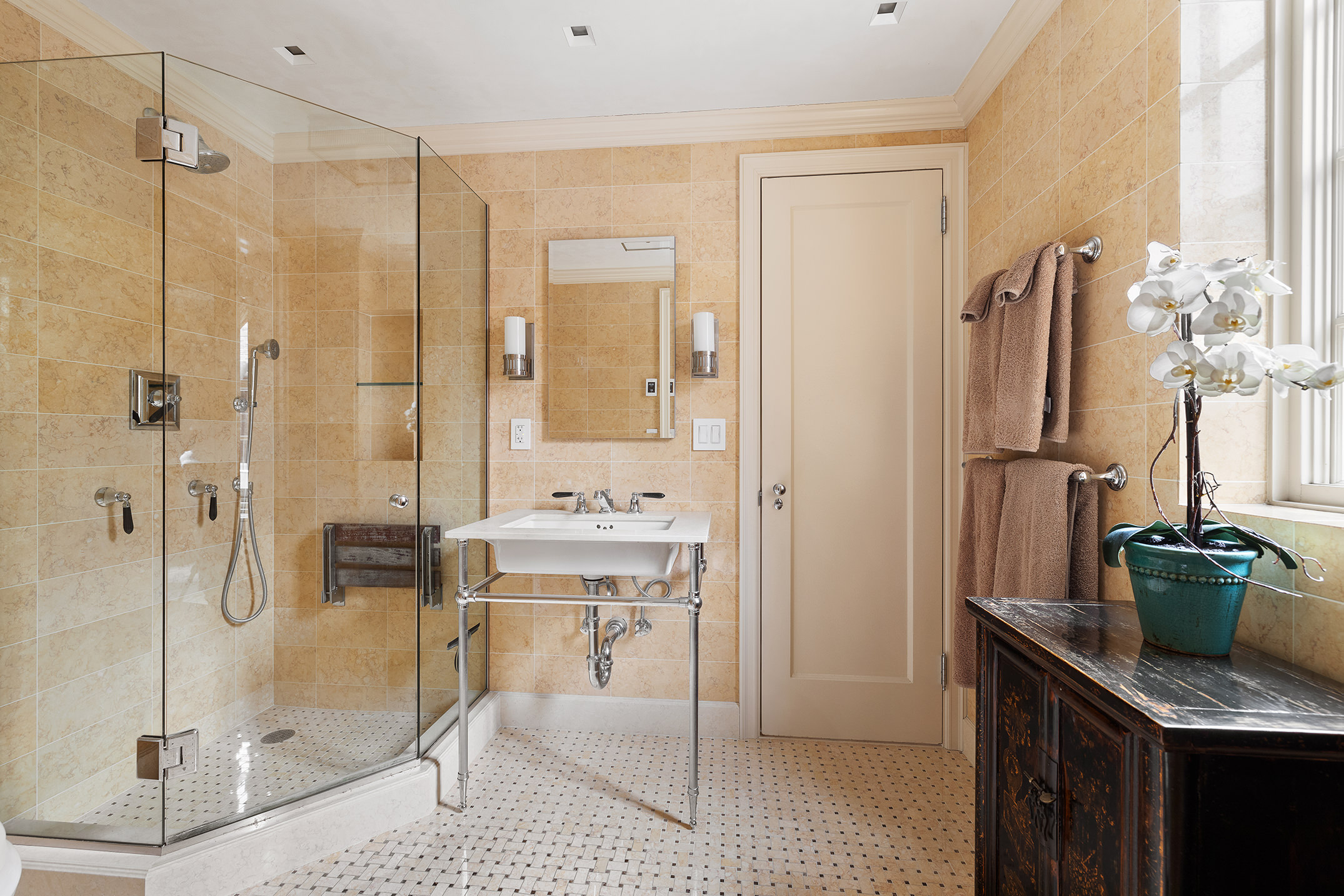 169 East 78th Street, Unit 5D Manhattan, NY 10075 - Photo 7 of 15 a bathroom with a granite countertop sink a toilet and shower
