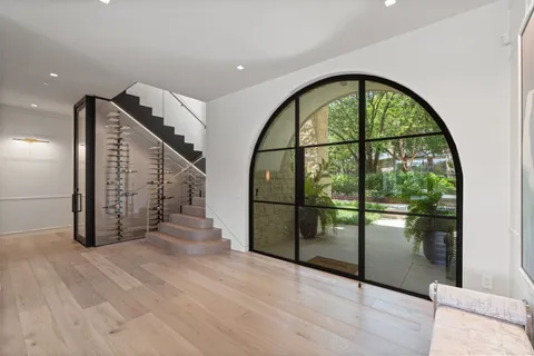a view of an entryway with wooden floor