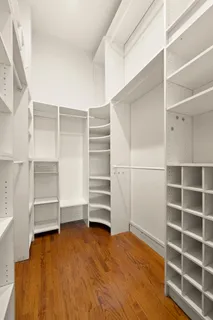 a bathroom with a sink mirror toilet and shower