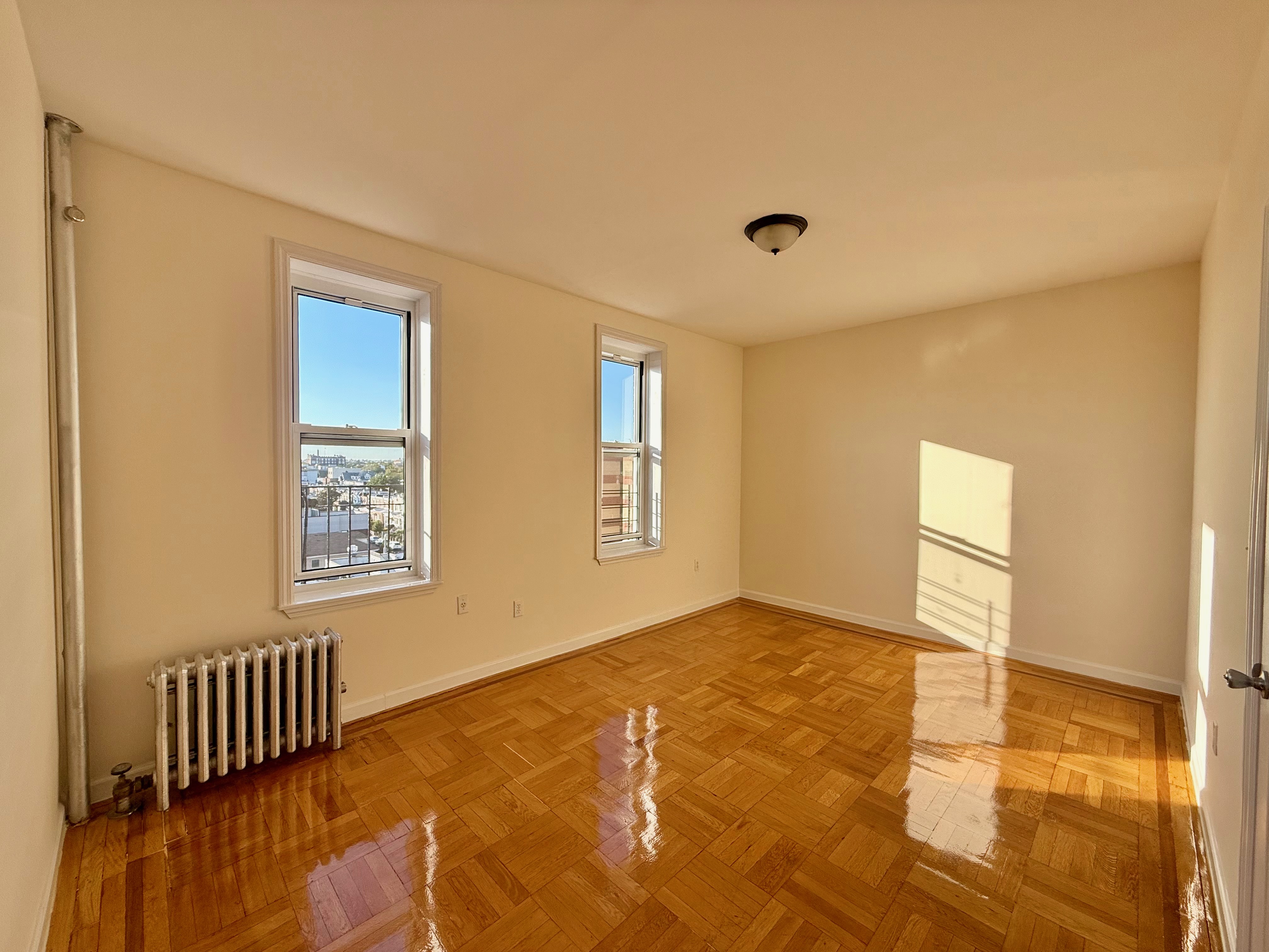 6309 Bay Parkway, Unit F5 Brooklyn, NY 11204 - Photo 5 of 7 a view of an empty room with a window