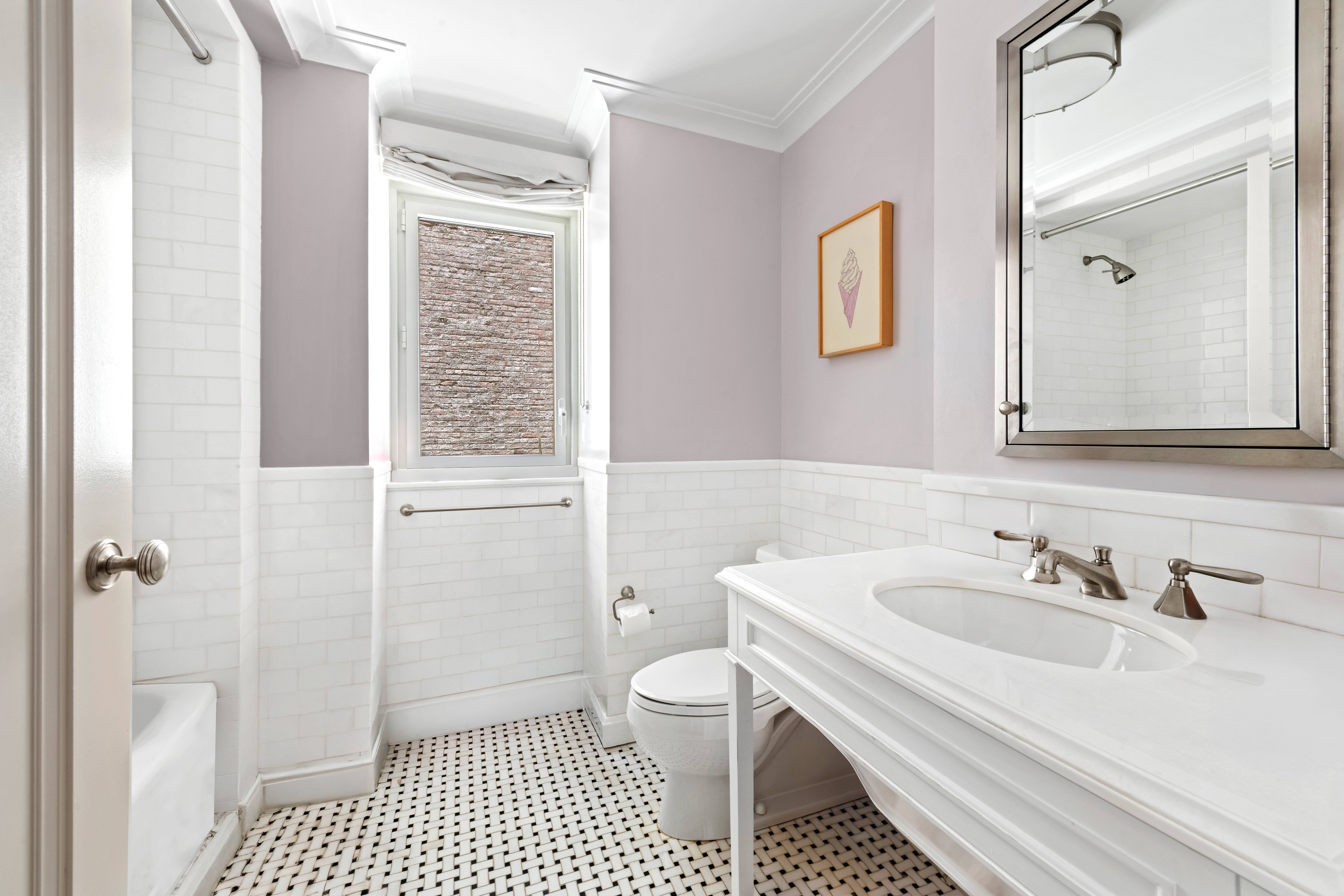 530 Park Avenue, Unit 3F Manhattan, NY 10065 - Photo 17 of 25 a bathroom with a sink a toilet and shower