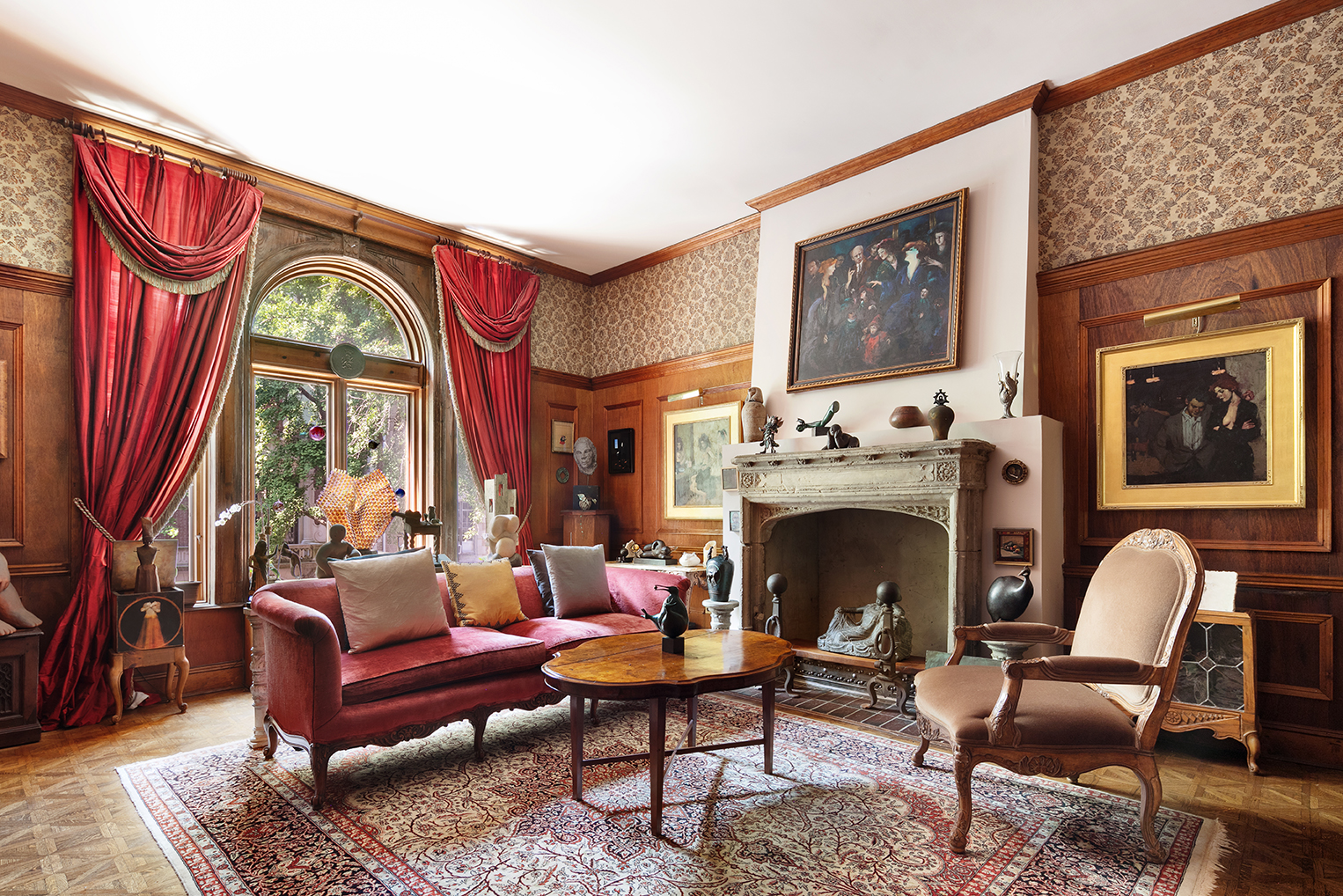 323 West 80th Street Manhattan, NY 10024 - Photo 7 of 24 a living room with furniture a large window and a fireplace