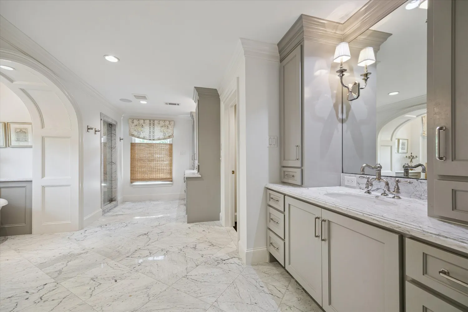 a spacious bathroom with a bathtub and window