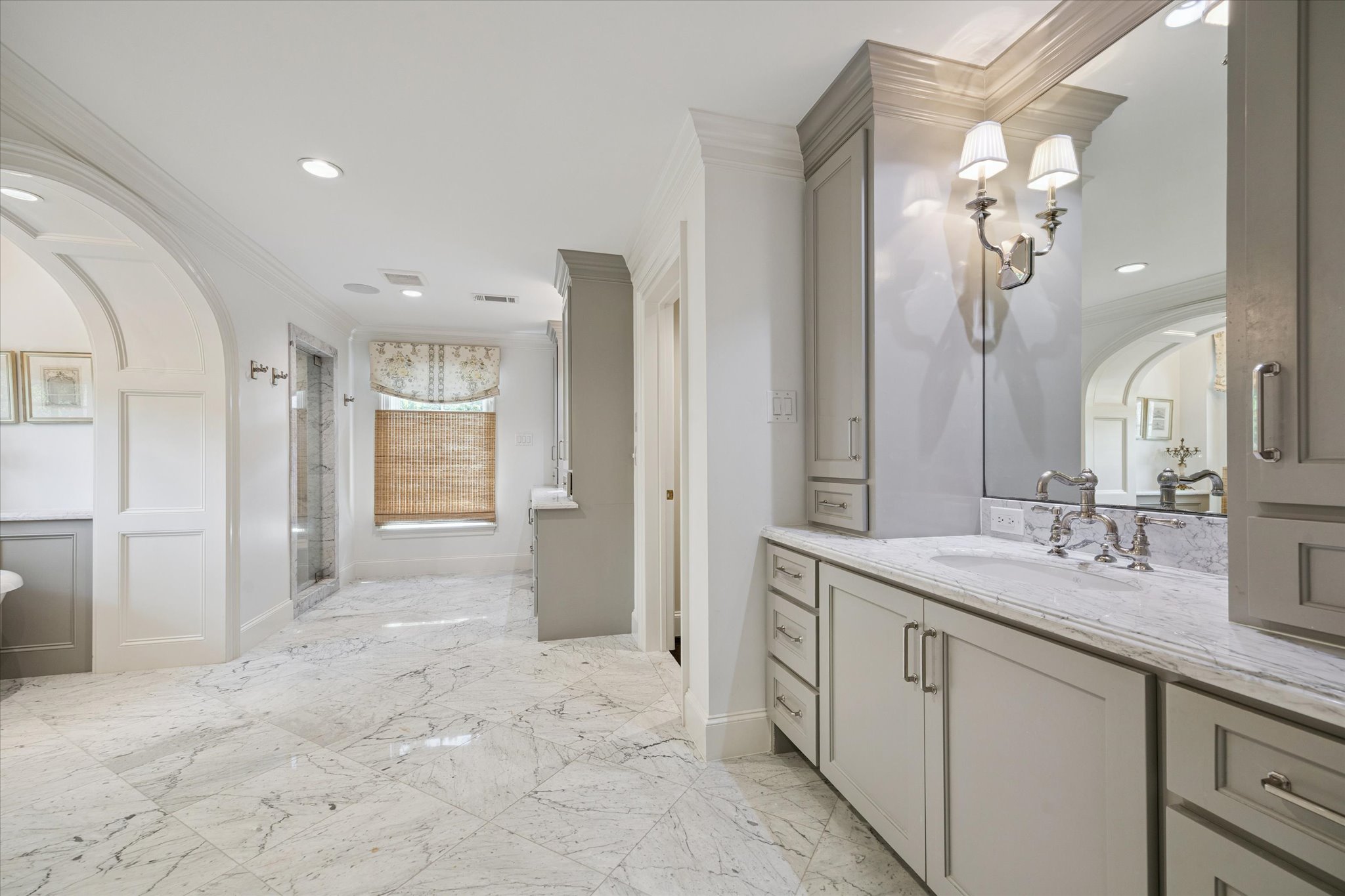 310 Longwoods Lane Houston, TX 77024 - Photo 28 of 49 a spacious bathroom with a granite countertop sink a mirror and a shower