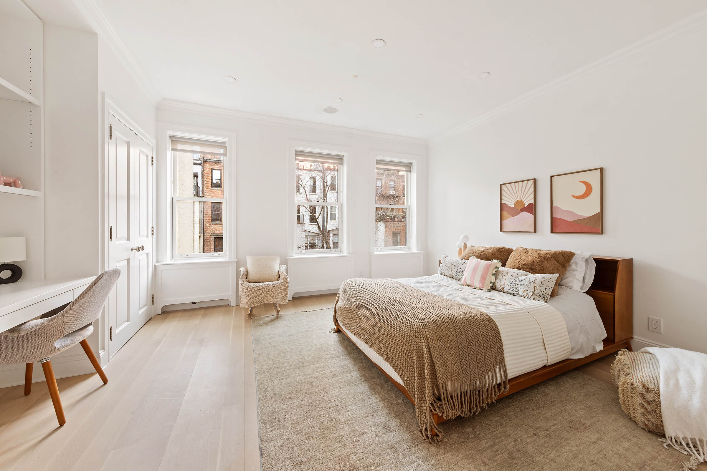 9 West 84th Street Manhattan, NY 10024 - Photo 18 of 31 a bedroom with a bed a table and chair