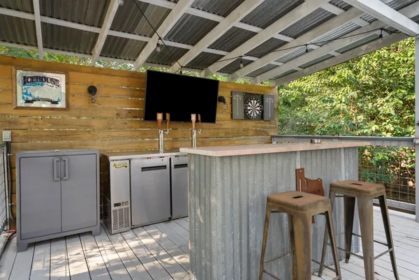a view of a porch with furniture and a backyard