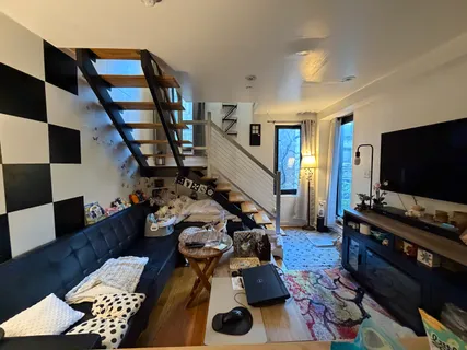 a living room with furniture and a flat screen tv