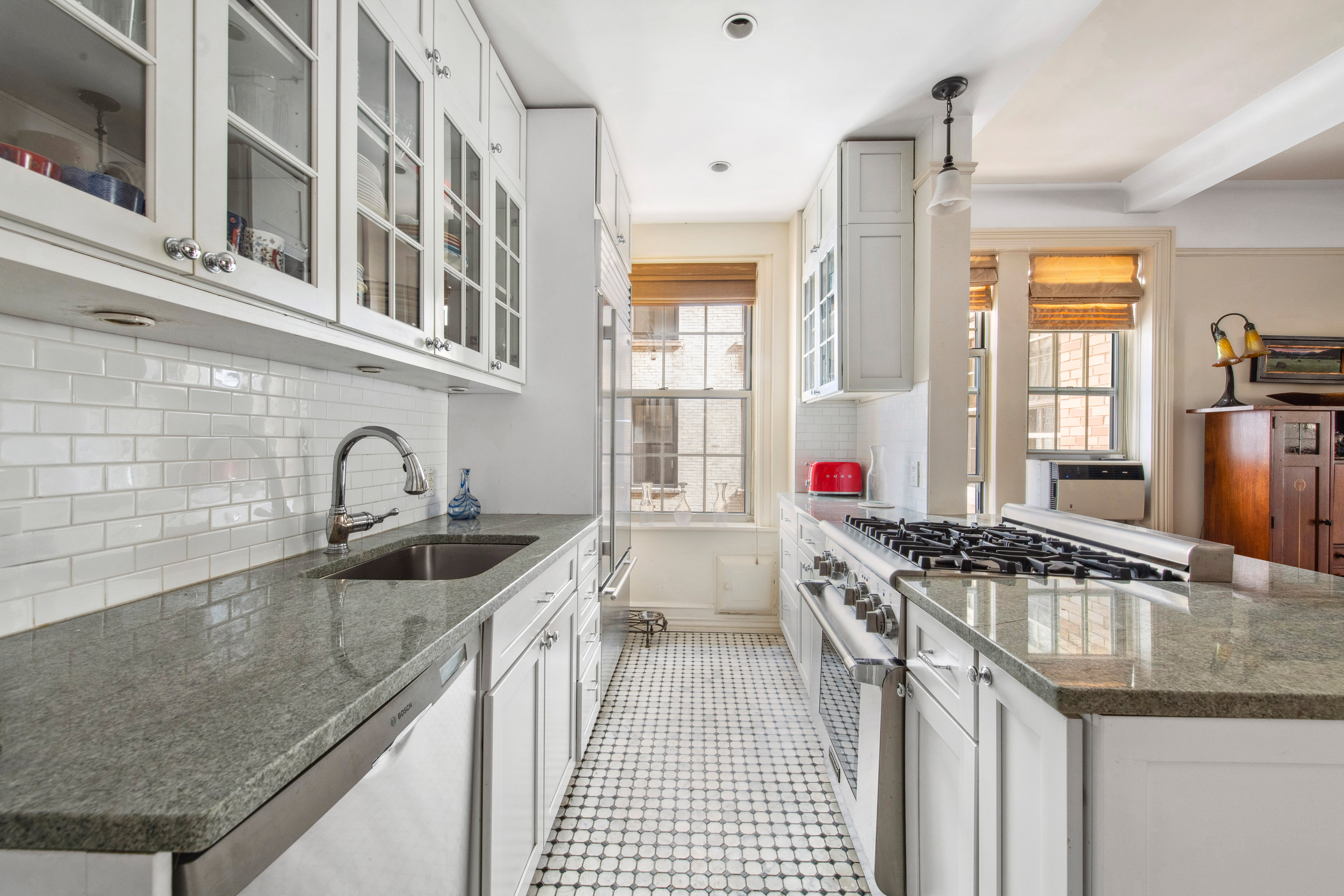 639 West End Avenue, Unit 5B Manhattan, NY 10025 - Photo 7 of 16 a kitchen that has a sink and a stove