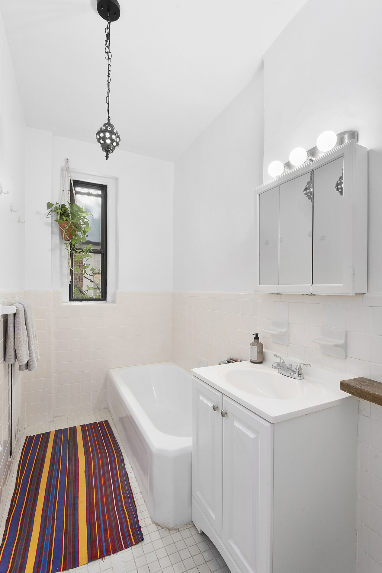 70 Lenox Road, Unit C4 Brooklyn, NY 11226 - Photo 6 of 7 a bathroom with a sink and a bathtub