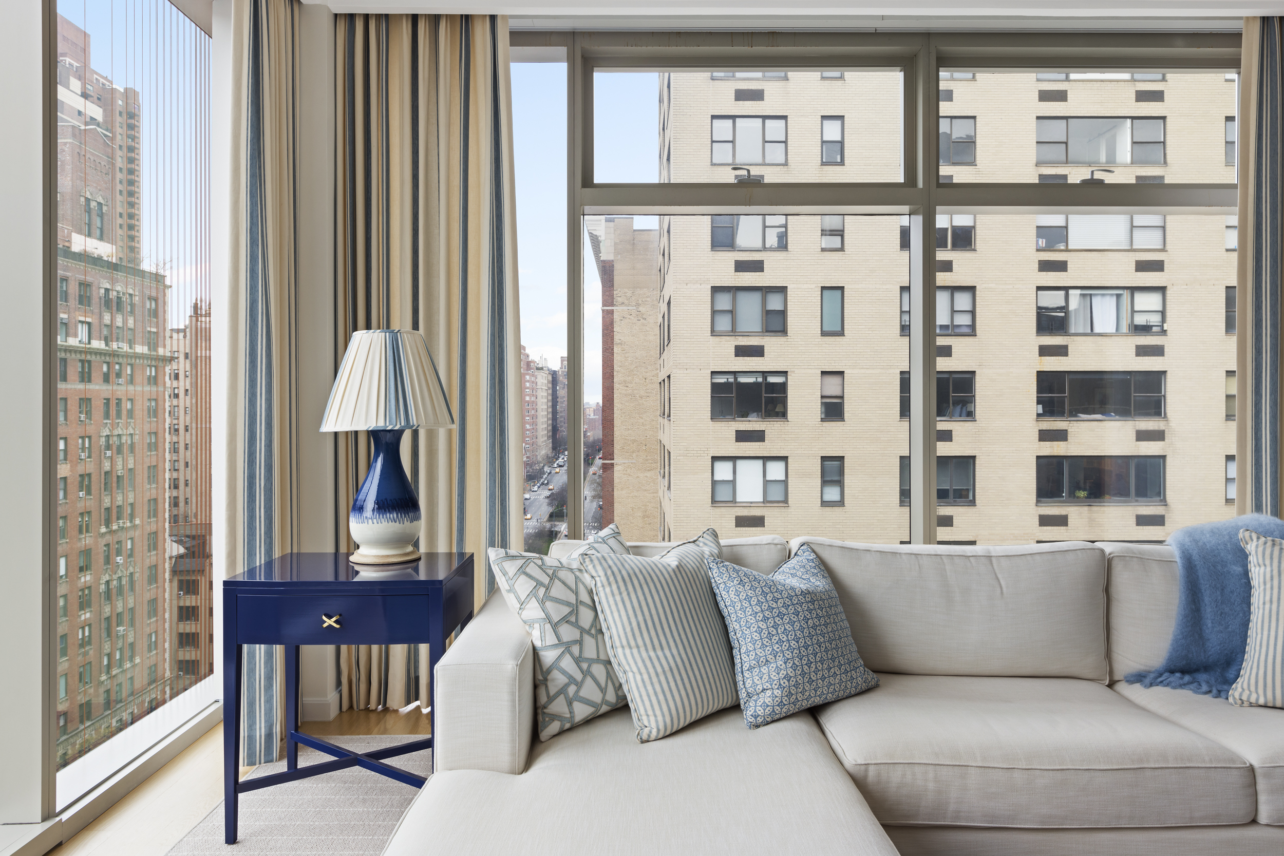 1055 Park Avenue, Unit PH Manhattan, NY 10028 - Photo 3 of 19 a living room with furniture and a window