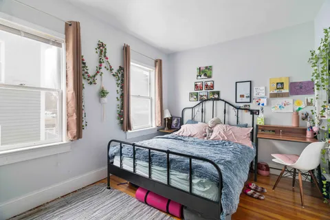 a bedroom with a bed and cabinets