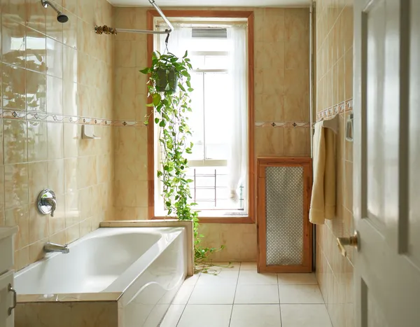 a bathroom with a tub and shower