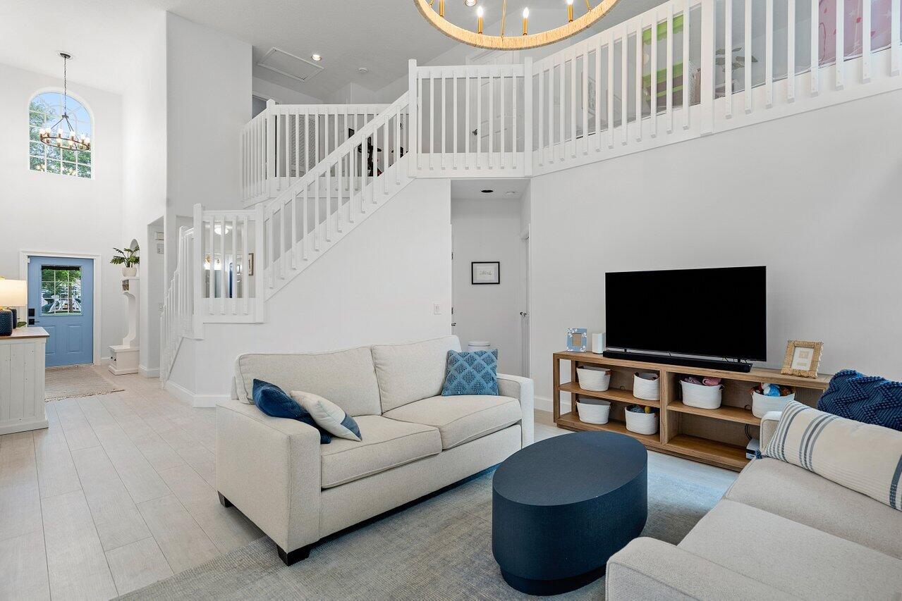 1182 Canoe Point Delray Beach, FL 33444 - Photo 7 of 46 a living room with furniture and a flat screen tv